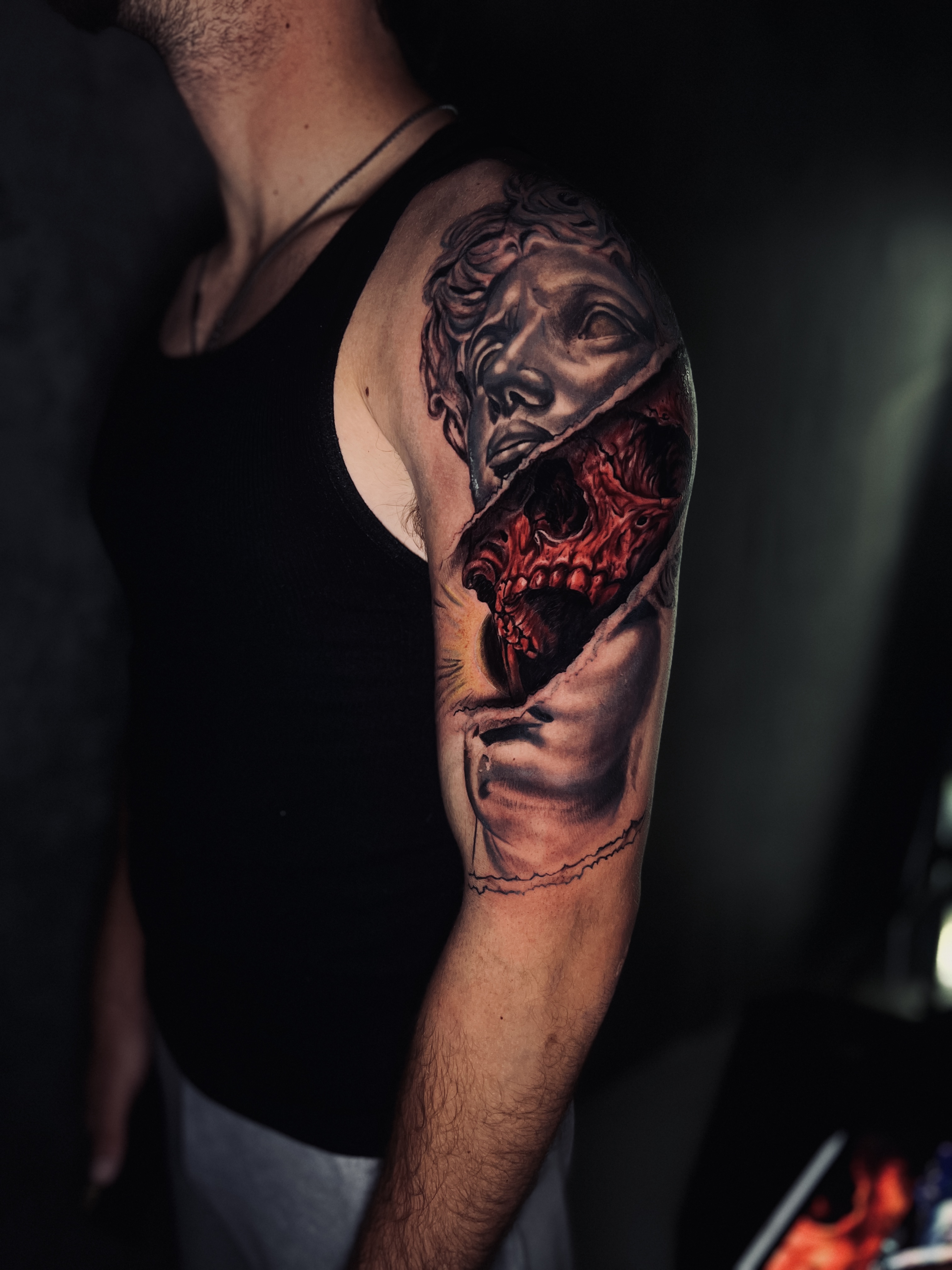 Greek bust with skull half sleeve