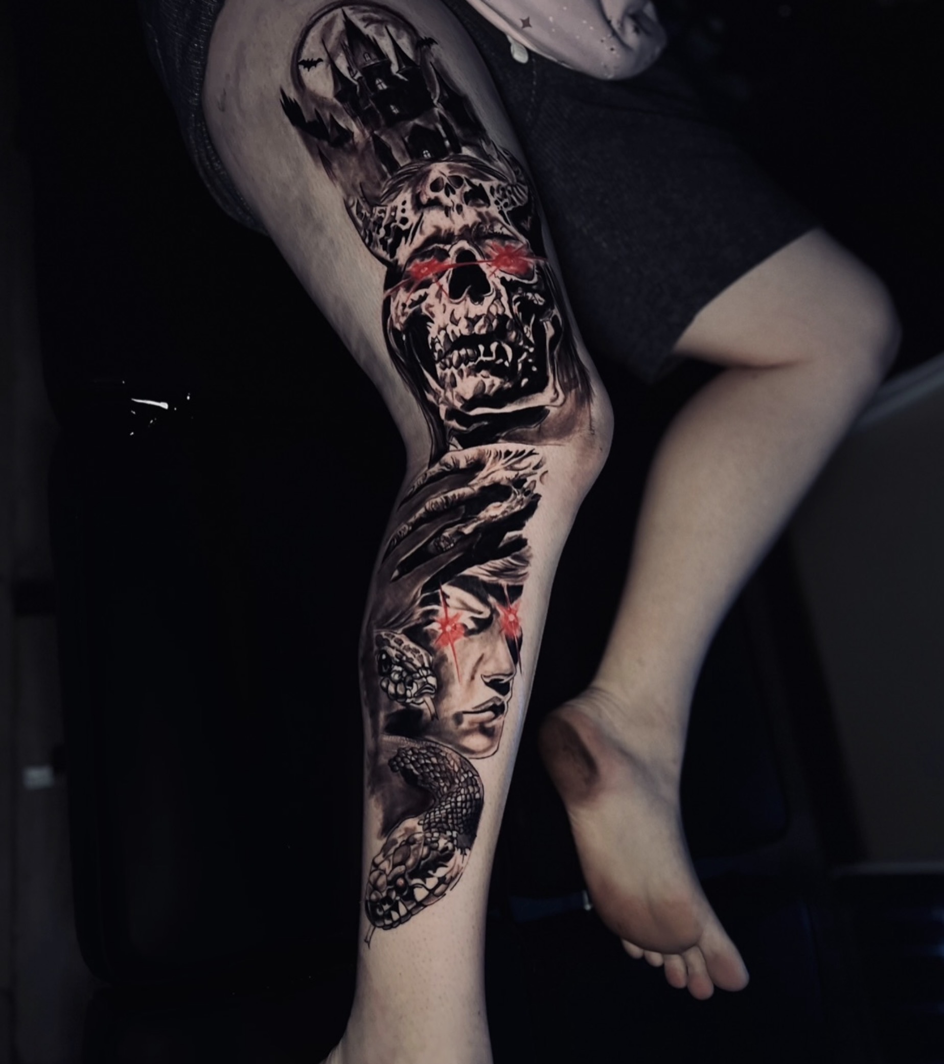 Narrative leg sleeve with skull and serpent